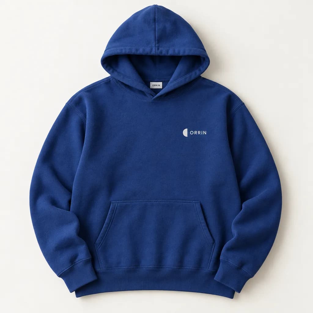 Cobalt blue heavyweight hoodie with a small white half-moon mark and the word ORRIN on the chest